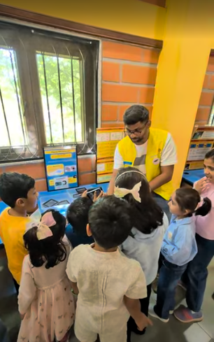 A guide showing exhibits to children in the science lab